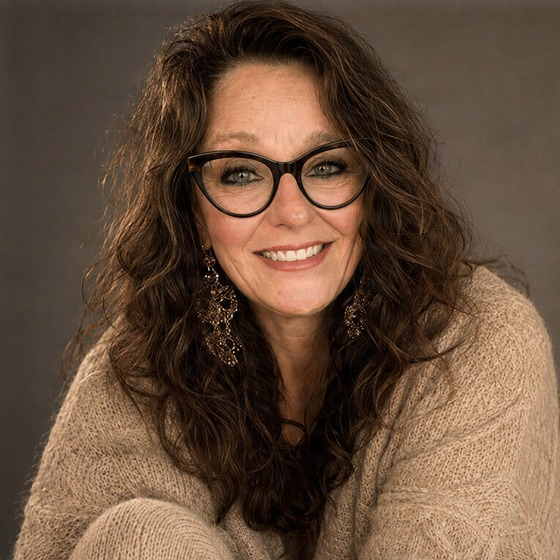 Christine Simonson, founder of Wild Thistle Moon LLC and builder of Disruptor Copy (AI portrait)
